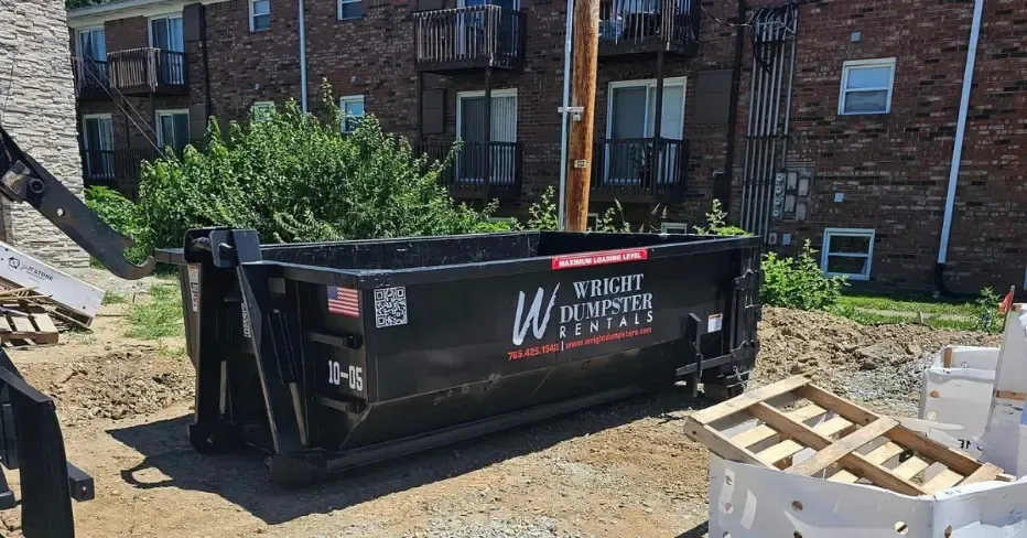 An image of a black colored roll-off yard dumptser provided by wright dumpster rentals