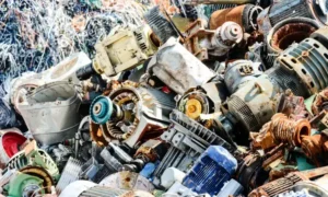 A pile of discarded electric motors and parts from appliances and machinery