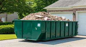 20-yard dumpster on a driveway filled with debris